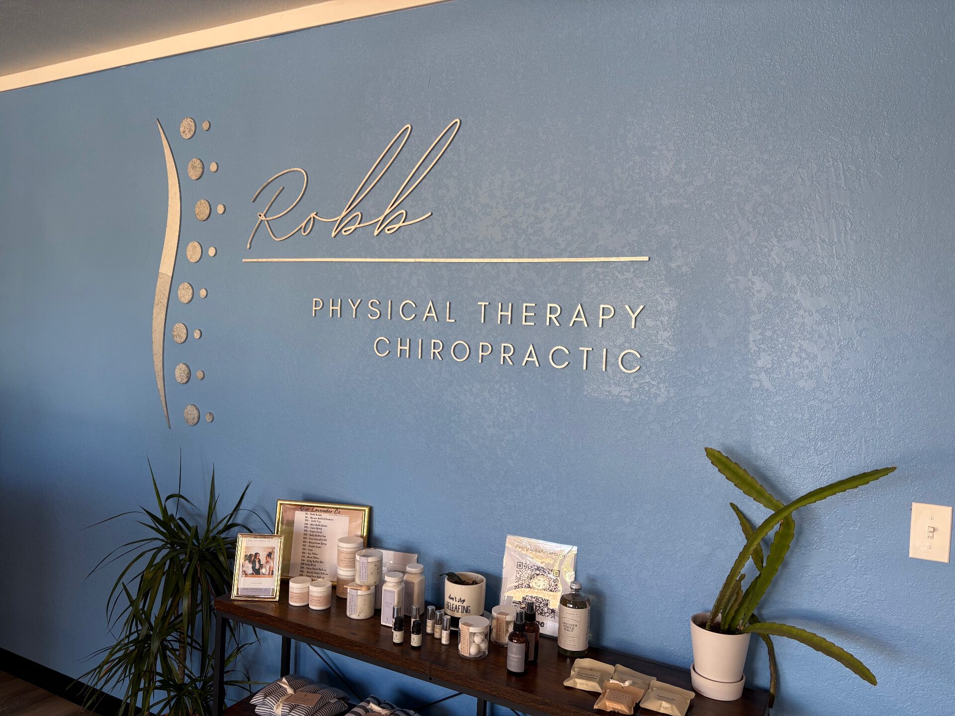 Robb Physical Therapy & Chiropractic signage on the clinic interior wall in Sidney, Nebraska